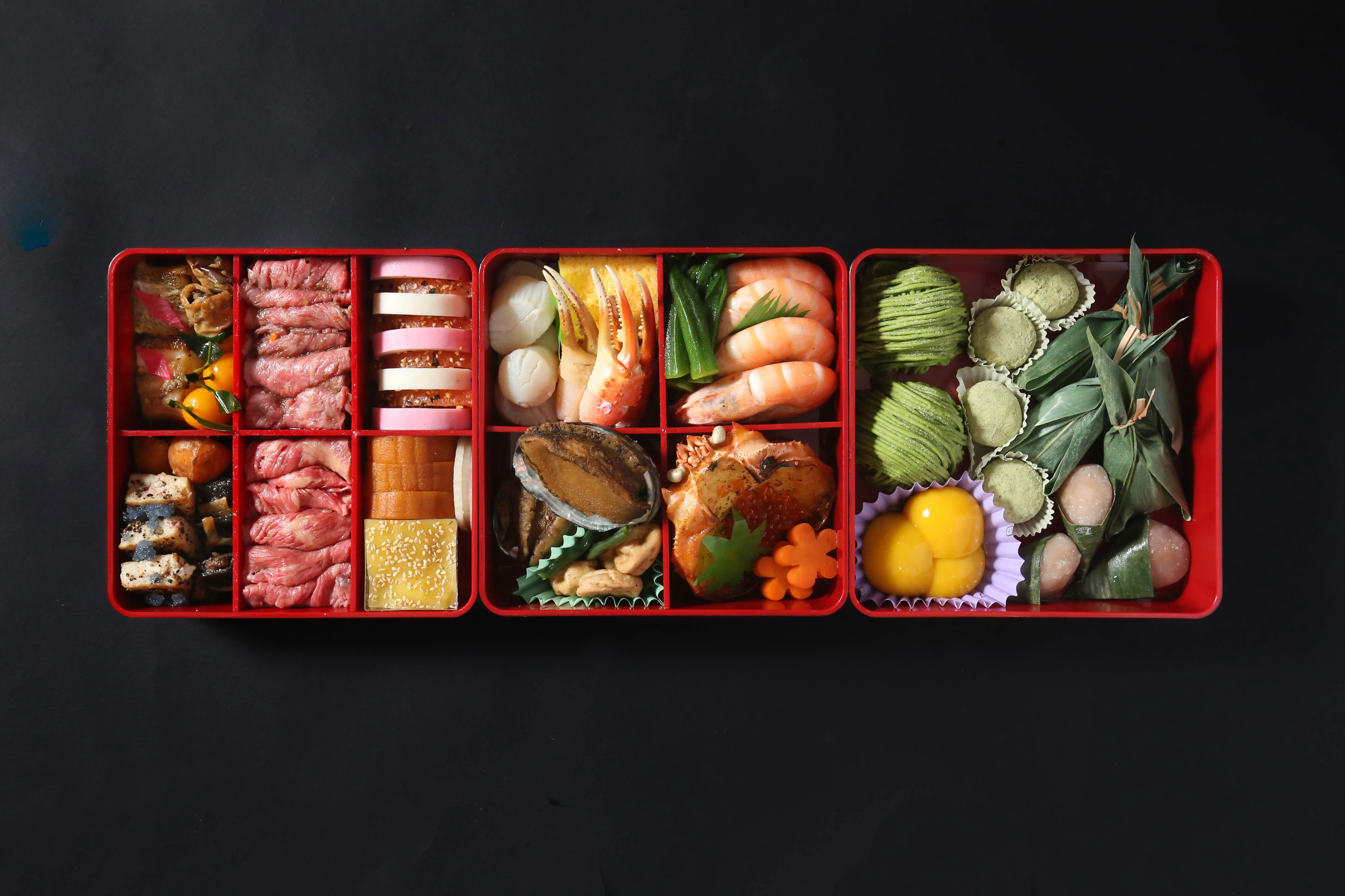 A traditional Japanese osechi box filled with gourmet delicacies.